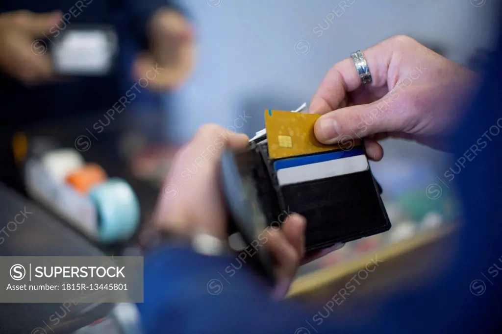 Man holding wallet with cards