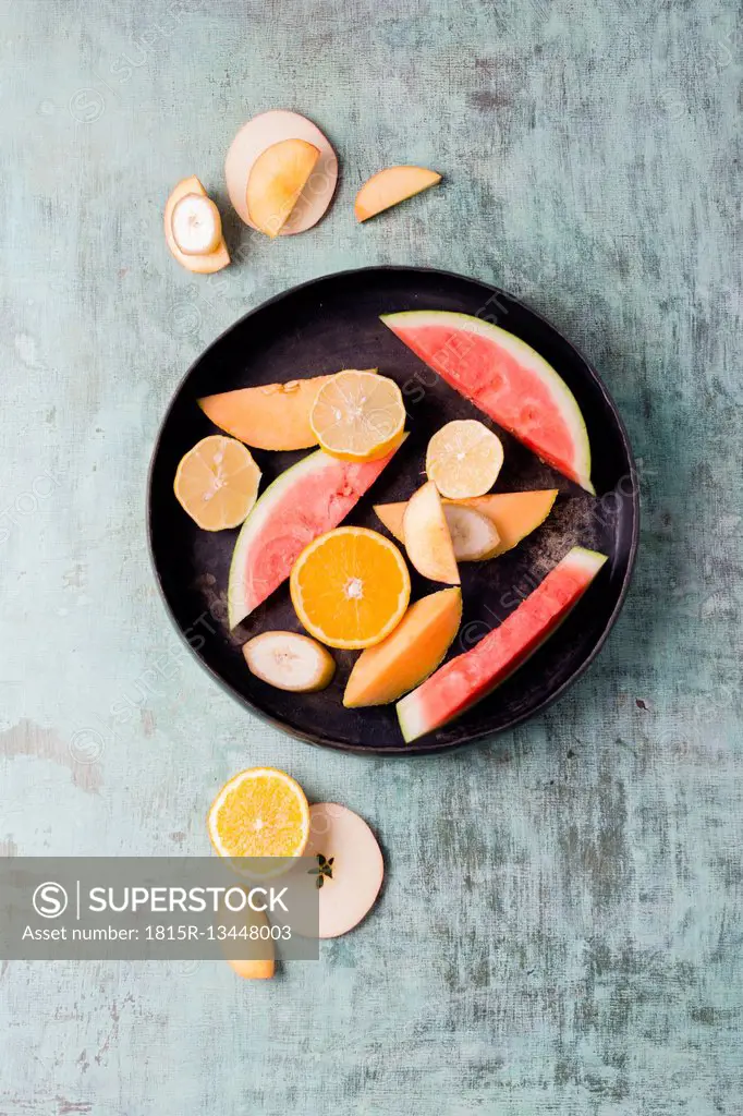 Plate with different fresh fruits