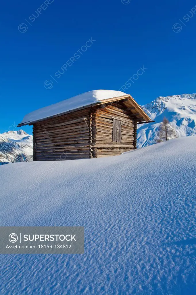 Switzerland, View of hut in snow
