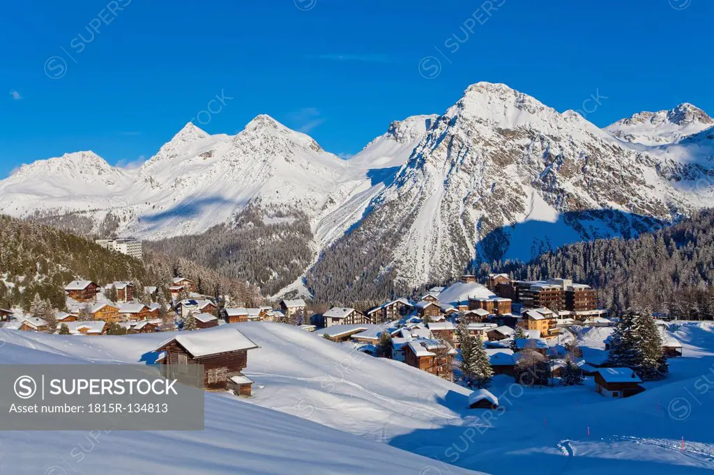 Switzerland, Arosa, view of chalet houses in snow