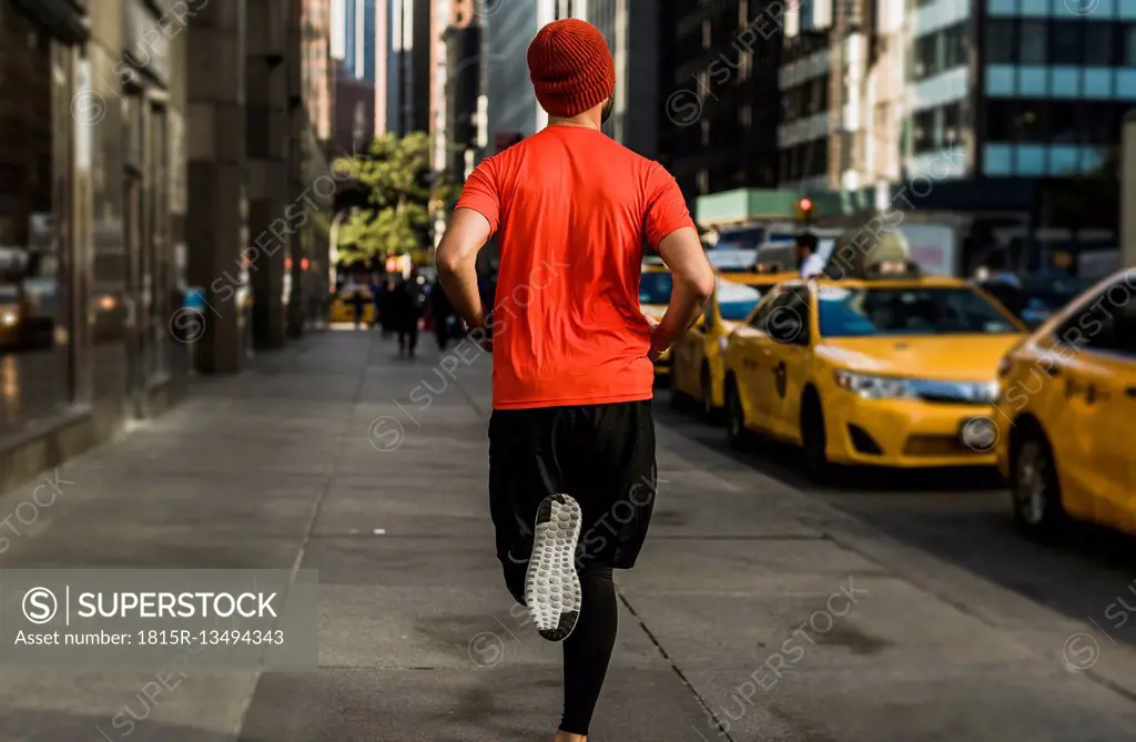 USA, New York City, man running in Manhattan