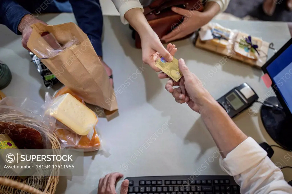 Customer paying with credit card in a farm shop