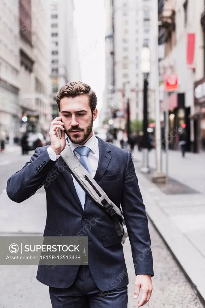 USA, New York City, businessman in Manhattan on cell phone