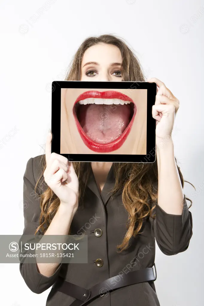 Businesswoman taking picture with digital tablet, close up