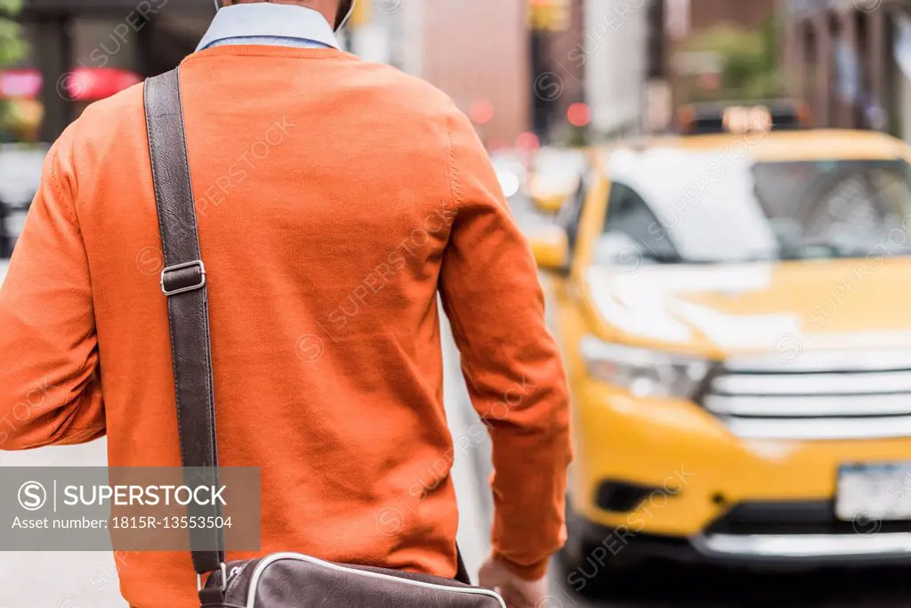 USA, New York City, Businessman approaching cab