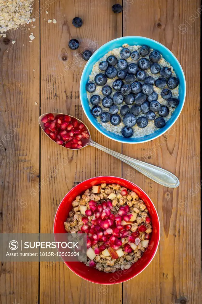 Bowl of overnight oats with blueberries and bowl of granola with pomegranate seed and red apple