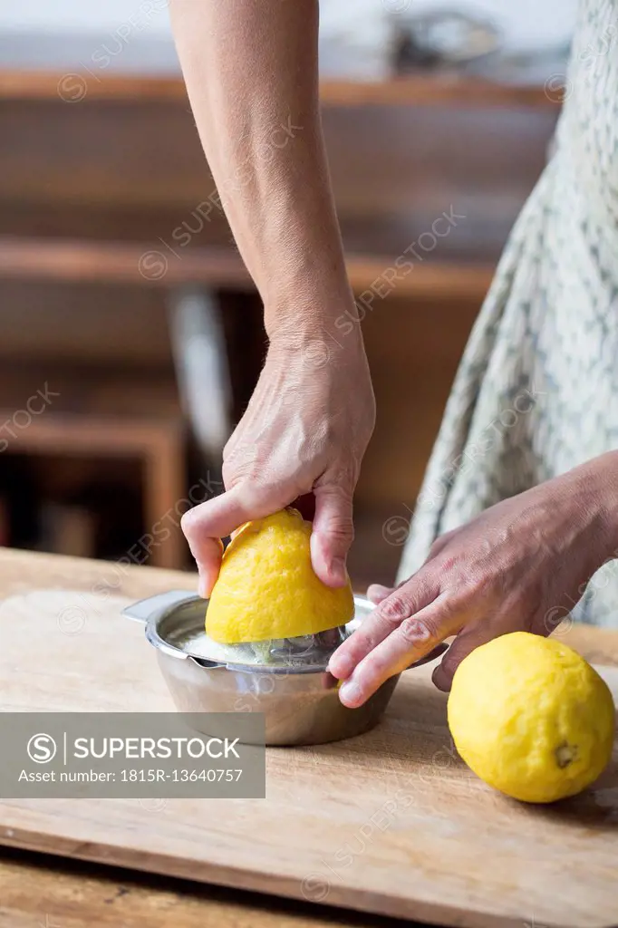 Woman squeezing lemon juice