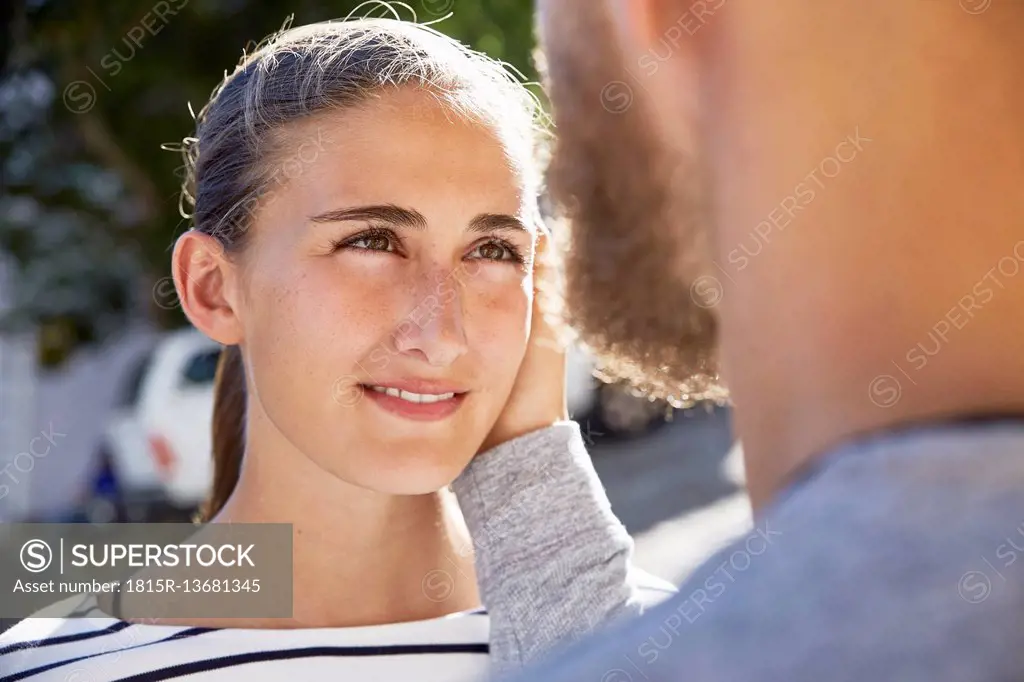 Portrait of young woman face to face to her partner