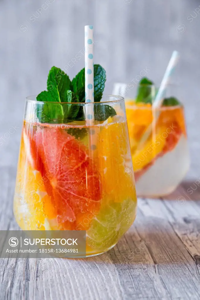 Two glasses of detox water infused with citrus fruits