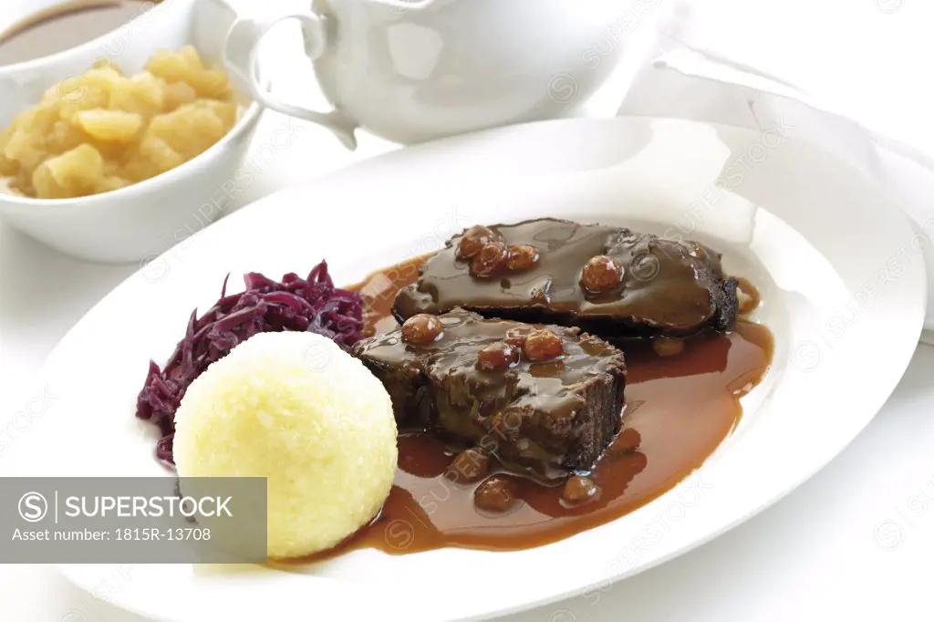 Germany, Rheinland, Roasted beef with dumplings on plate, close-up