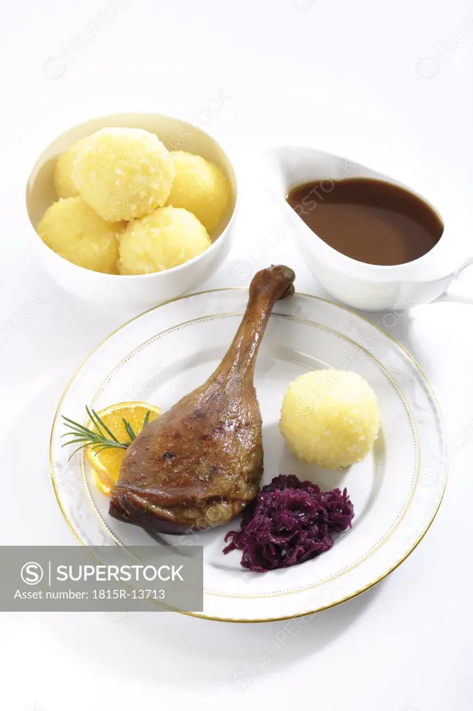 Roast goose with side dishes, elevated view