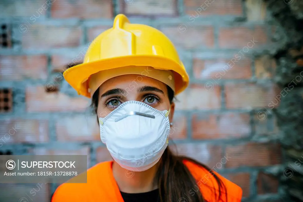 Portrait of woman wearing dust mask