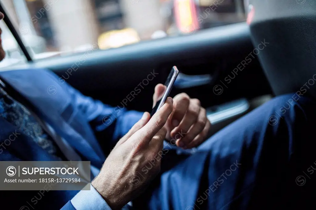 Businessman using smart phone, close up