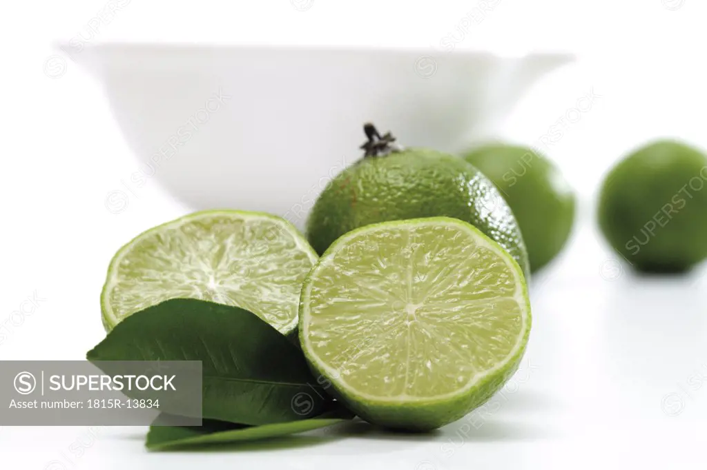 Lime fruits infront of bowl