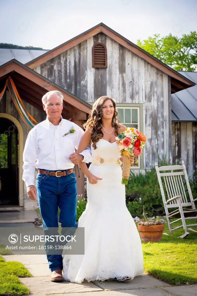USA, Texas, Father of bride and his daughter at outdoor wedding