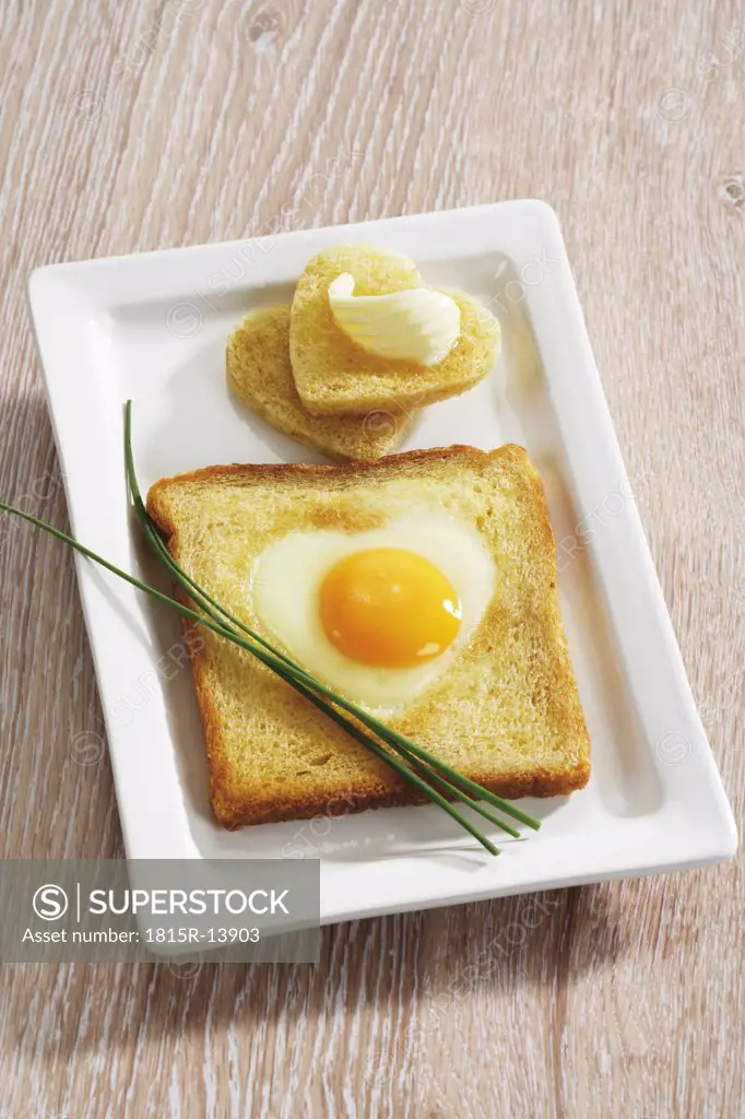 Fried egg (heart shape) in toast bread, elevated view