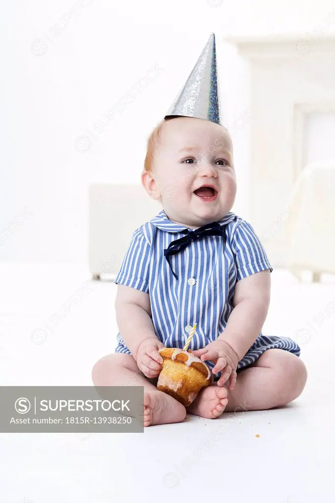 Portrait of baby boy with birthday cake