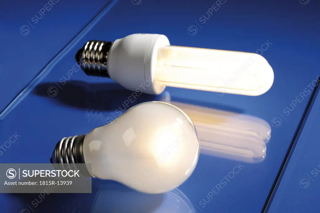 Energy saving lamp and electric bulb, close-up