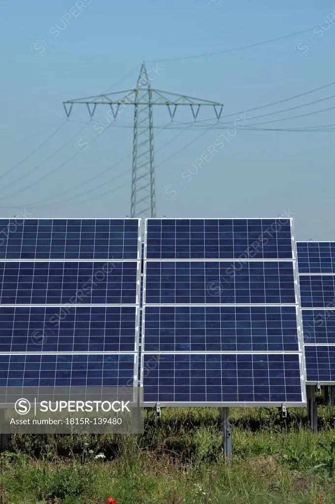 Germany, Bavaria, Solar panels with power pole in background
