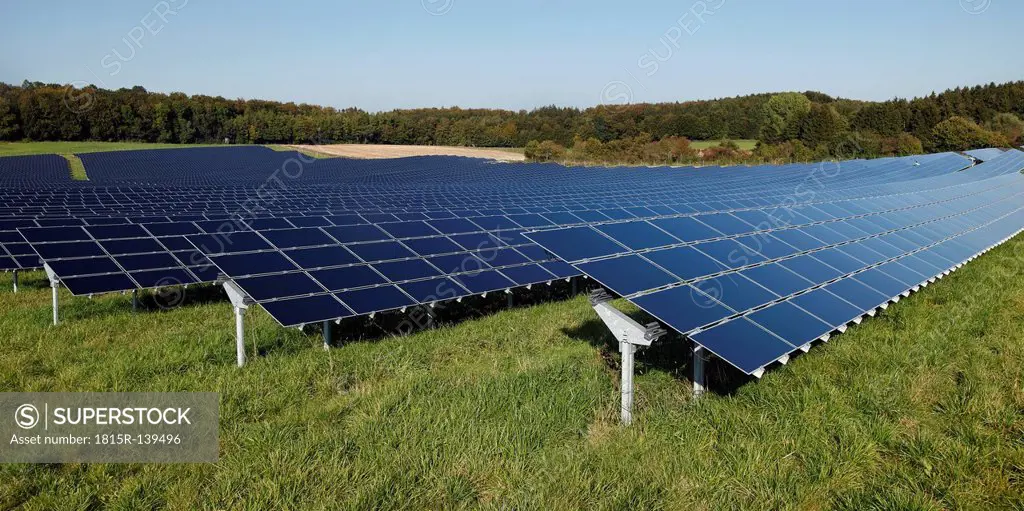 Germany, Bavaria, Solar panels on grass against sky