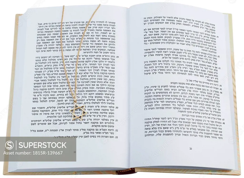 Jewish Torah with star of david necklace on white background, close up