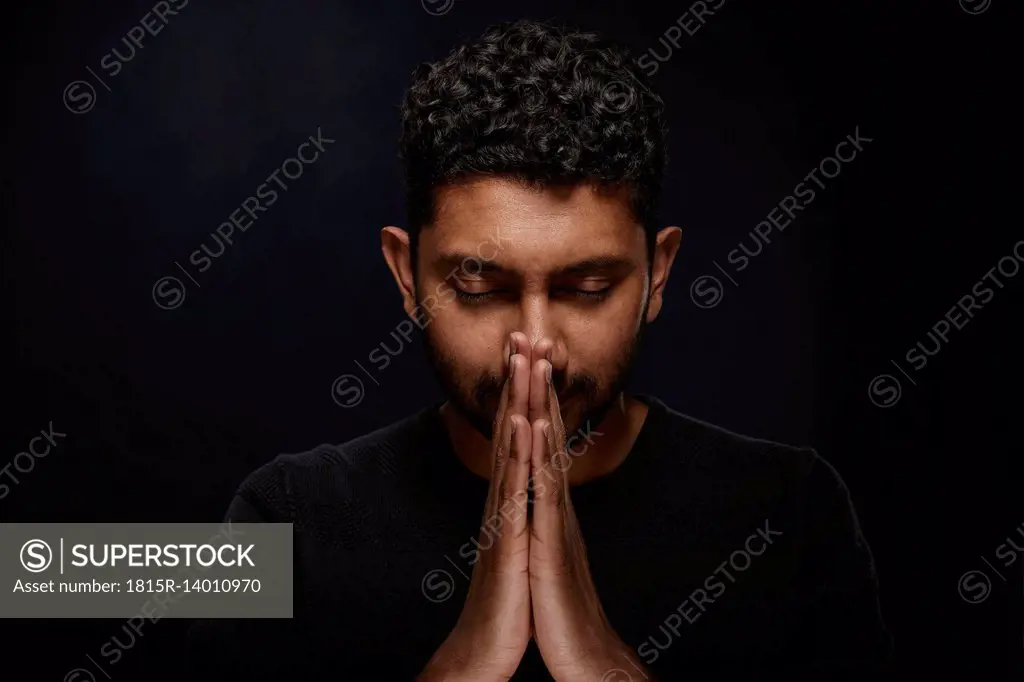 Portrait of praying man