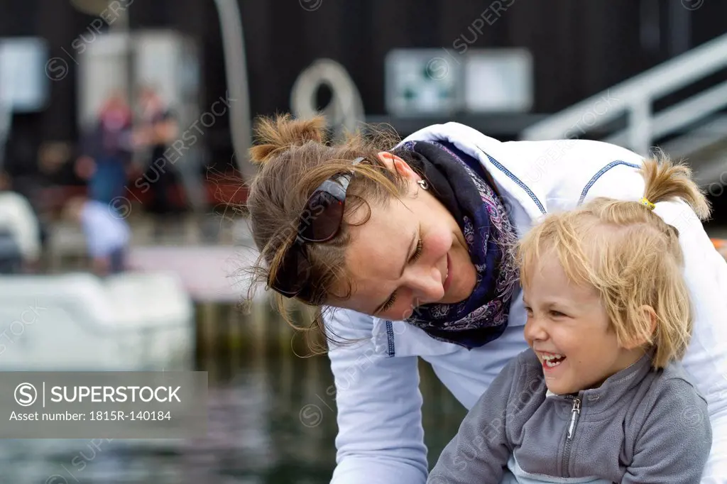 Germany, Kiel, Girl laughing with her mother