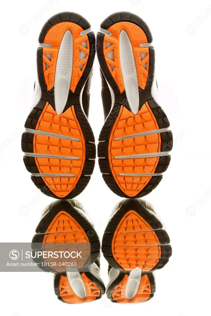 Pair of running shoes on white background, close up