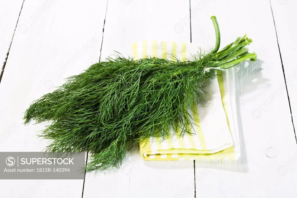 Bunch of fresh dill on wooden table, close up