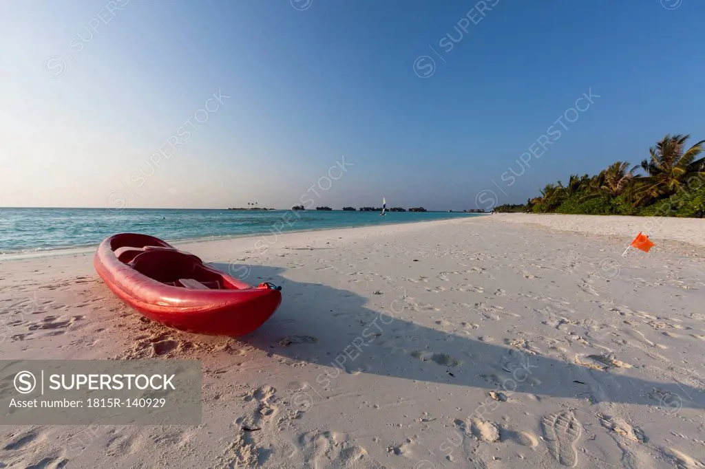 Maldives, Canoe on beach at Island