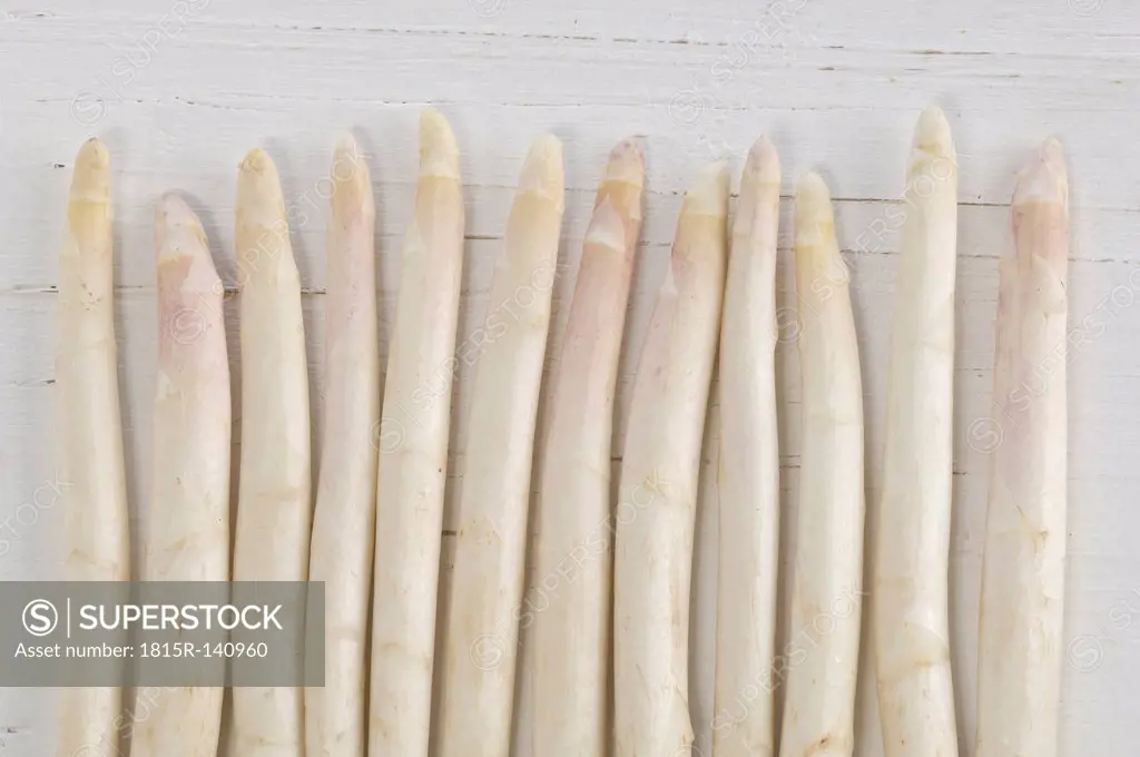 White asparagus on wooden table, close up