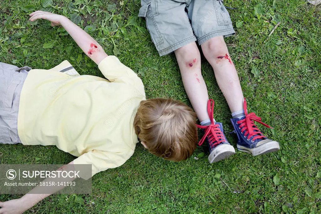 Germany, North Rhine Westphalia, Cologne, Boys injured in playground