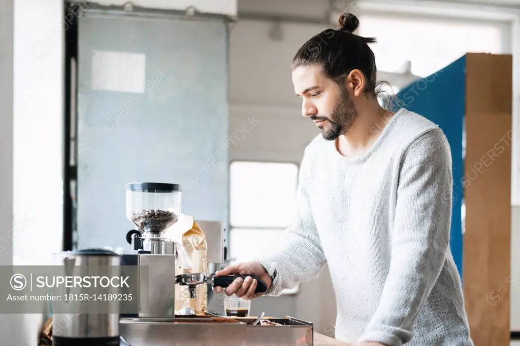 Man preparing espresso with espresso machine