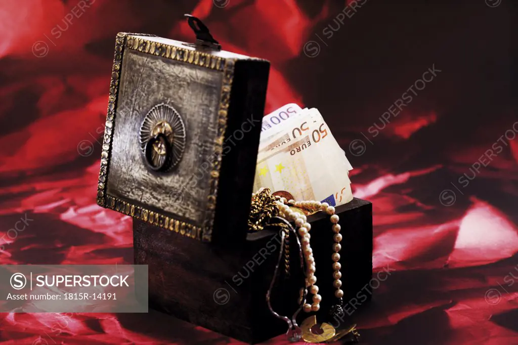 Treasure box full of money and jewellery