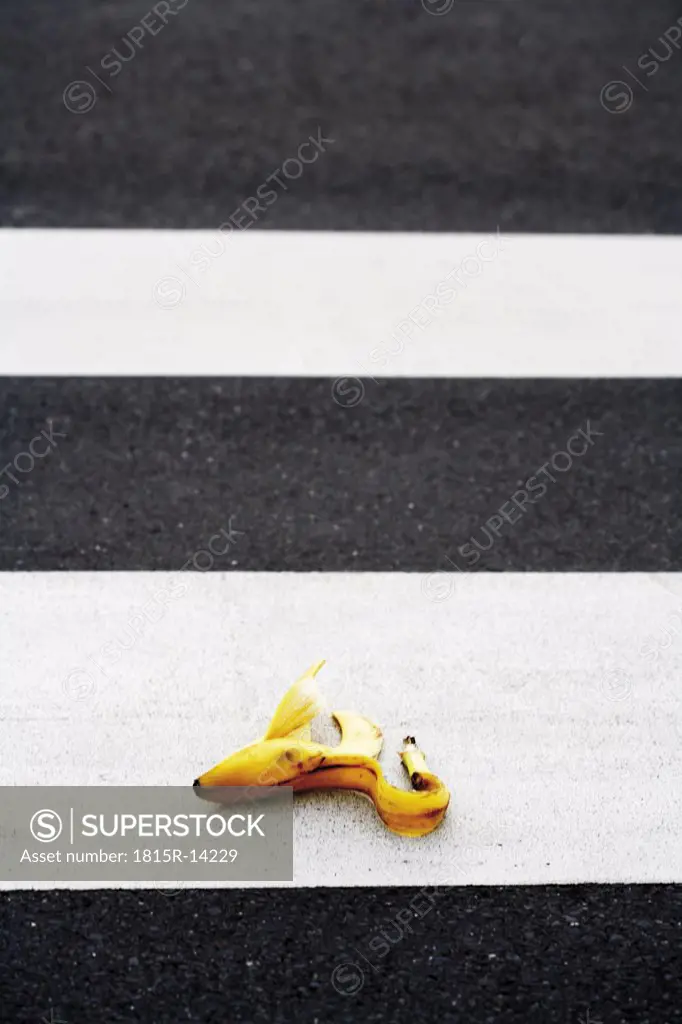 Banana peel lying on crosswalk