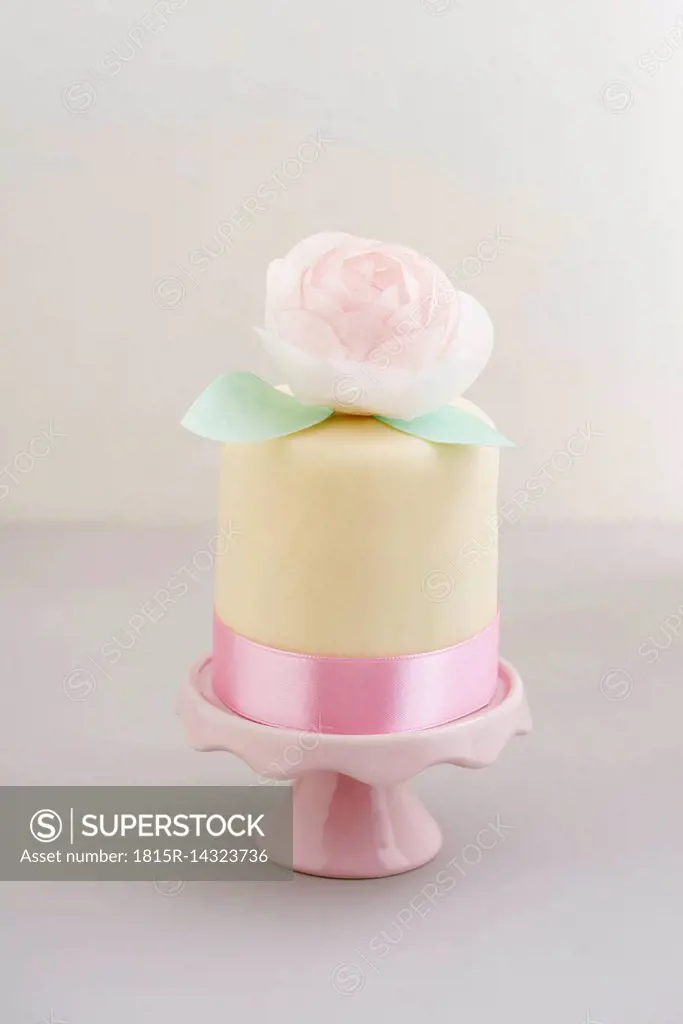 Mini fancy cake with fondant and peony made of edible paper