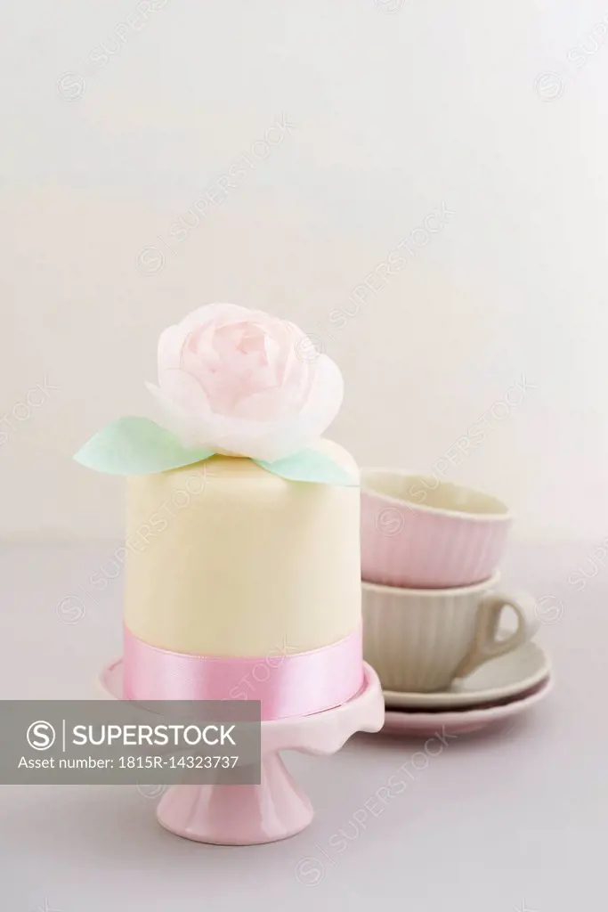 Mini fancy cake with fondant and peony made of edible paper
