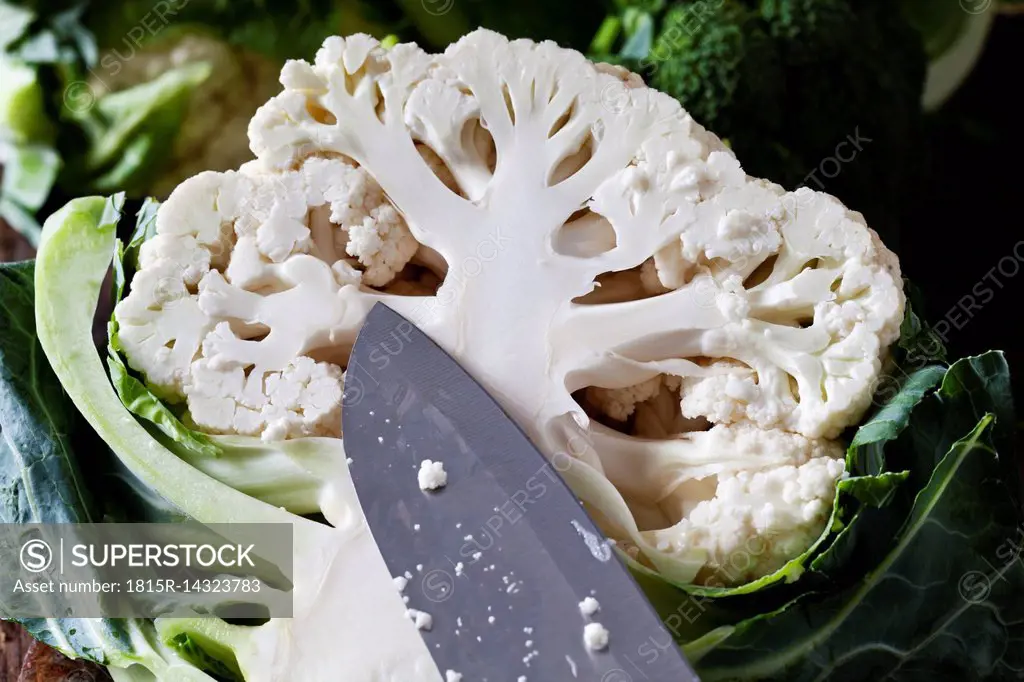 Half cauliflower and knife, close-up