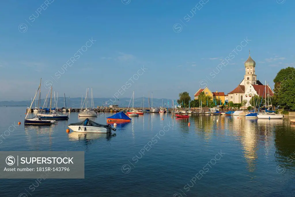 Germany, Bavaria, Wasserburg, View of St Georg church at harbour