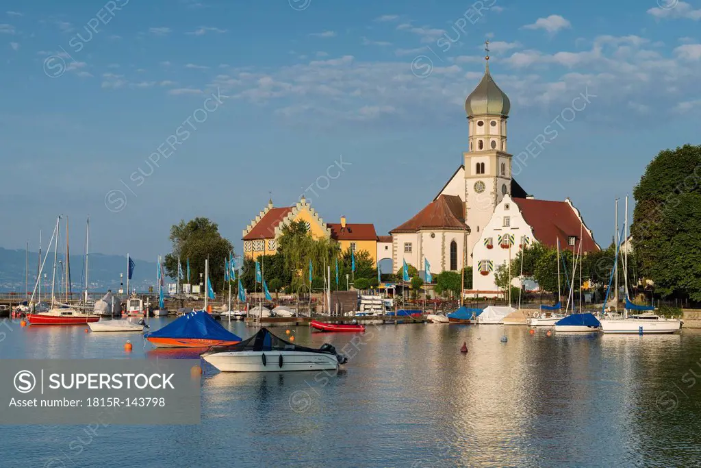 Germany, Bavaria, Wasserburg, View of St Georg church at harbour
