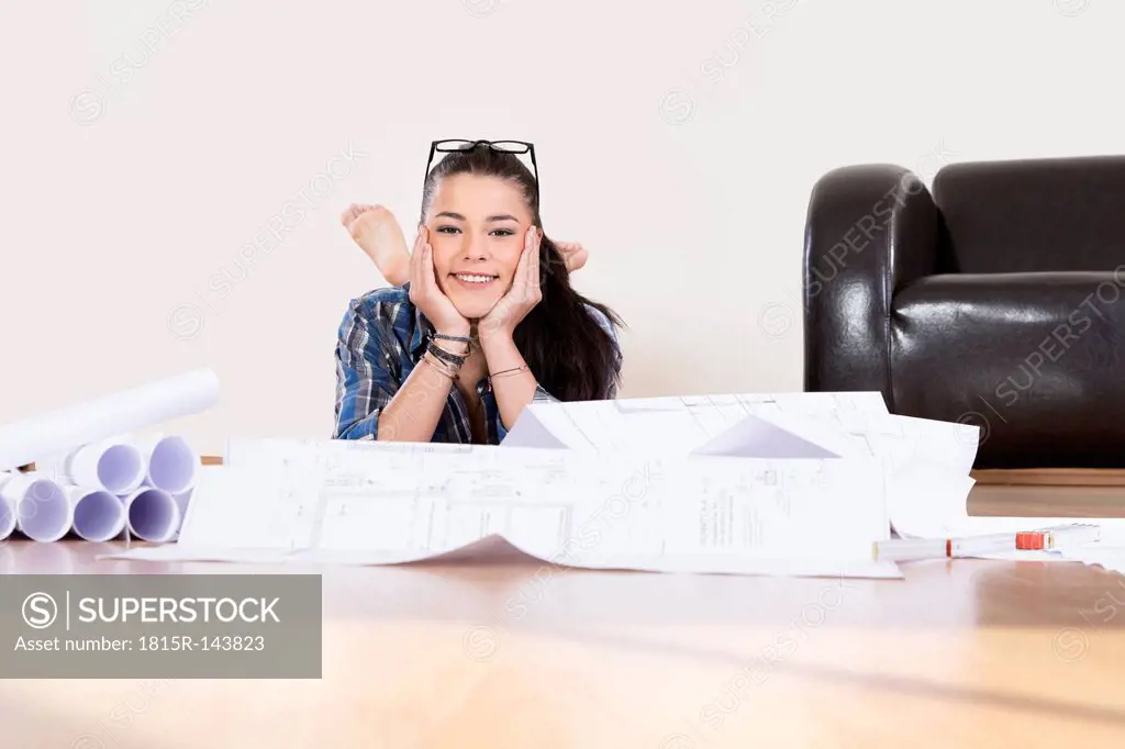 Portrait of young woman planning her first apartment, smiling