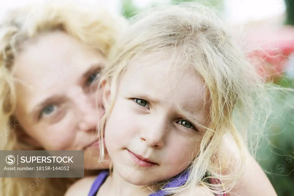Germany, North Rhine Westphalia, Cologne, Portrait of girl with her mother, close up