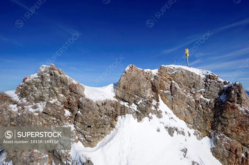 Germany, Bavaria, View of summit cross at Zugspitze Mountain