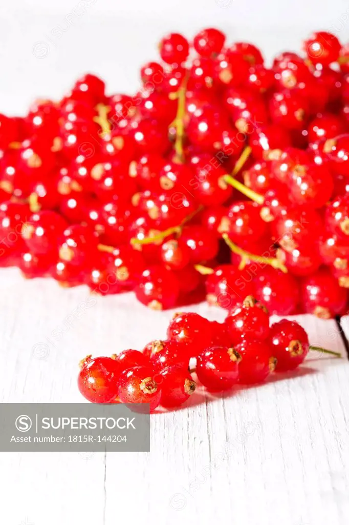 Currants on wooden table, close up