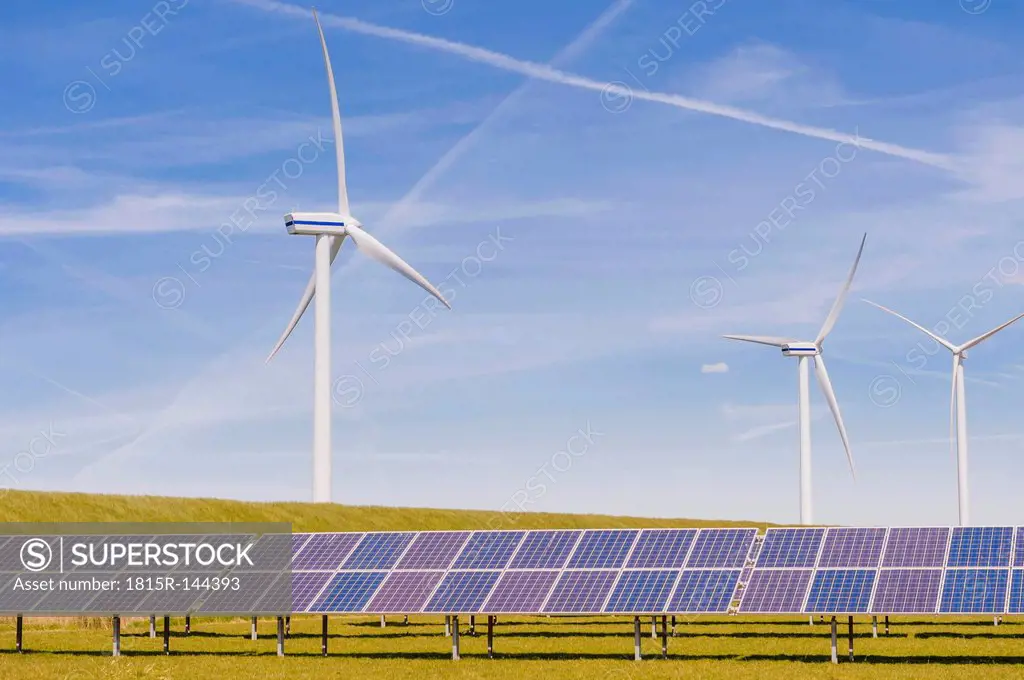 Germany, Schleswig-Holstein, View of solar panel and wind turbine in field