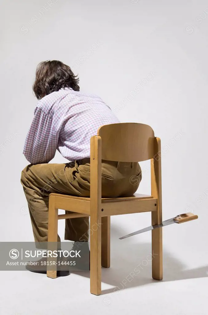 Mature man sitting on chair