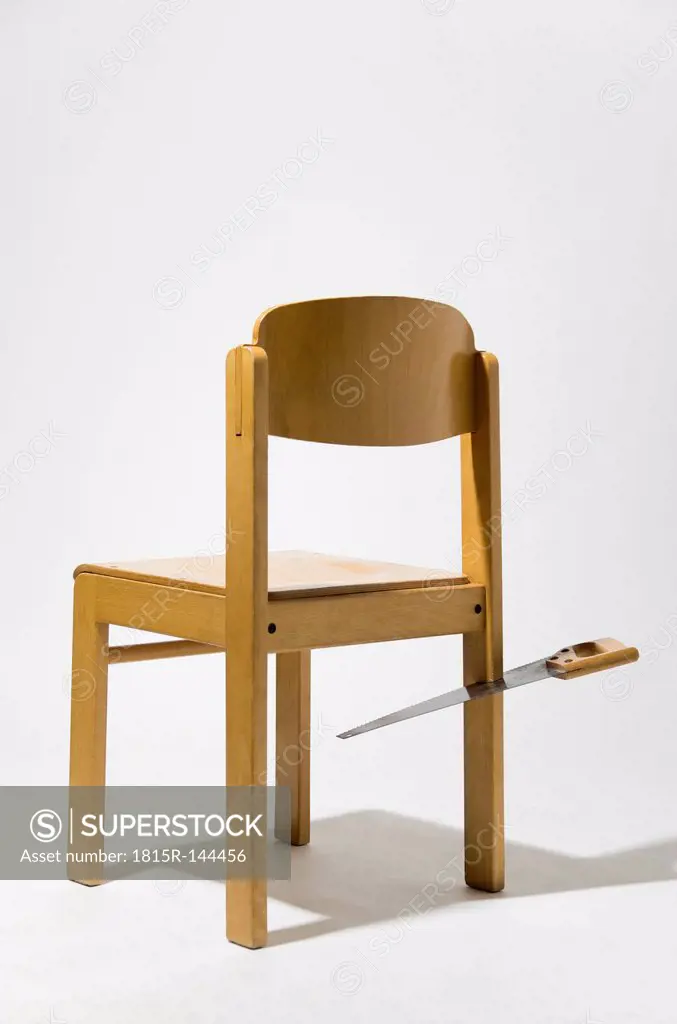 Envy chair with saw on white background, close up