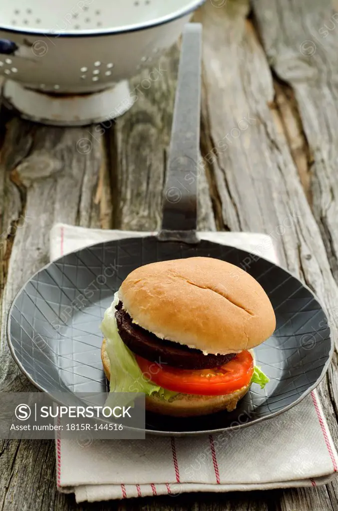 Vegetarian hamburgers with tomatoe and salad in pan