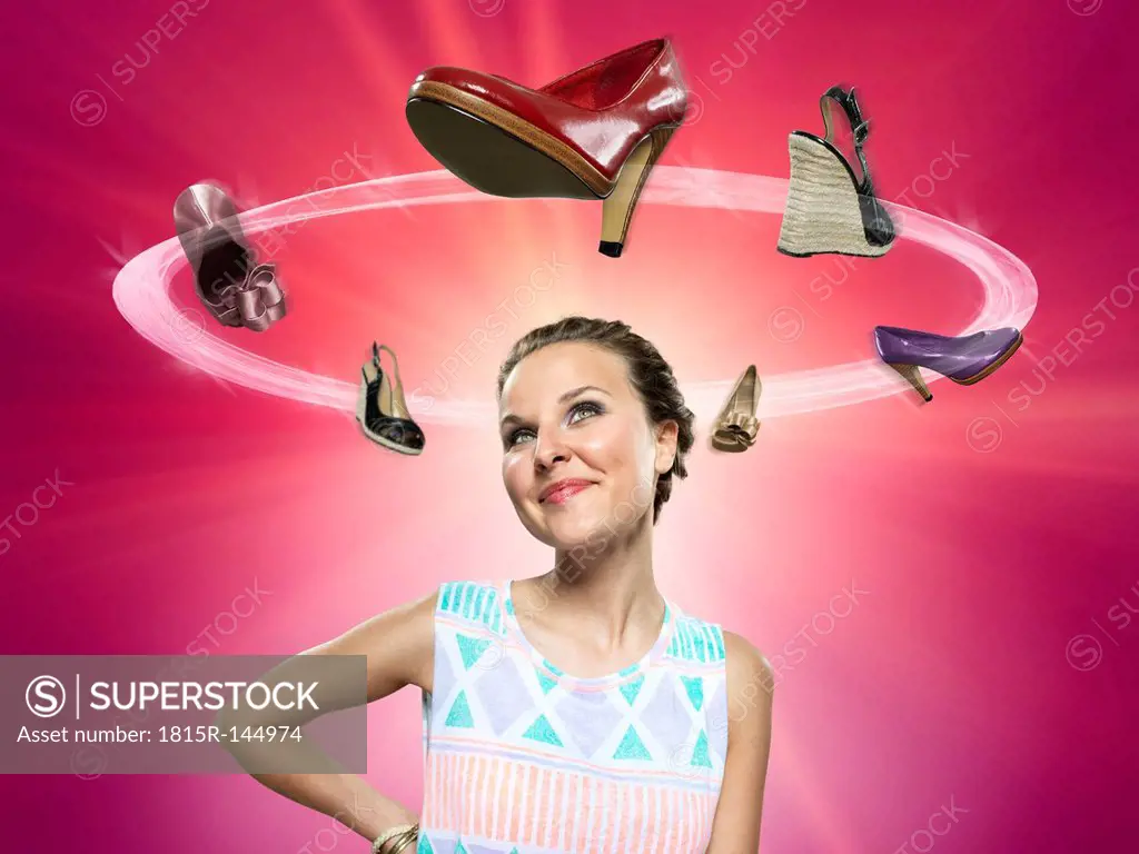 Smiling young woman looking at flying shoes, Composite
