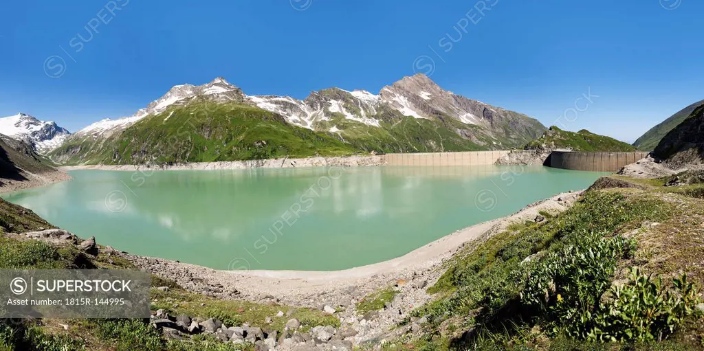 Austria, Mooserboden with masonry dam, the lake Mooserboden and peak Kitzsteinhorn